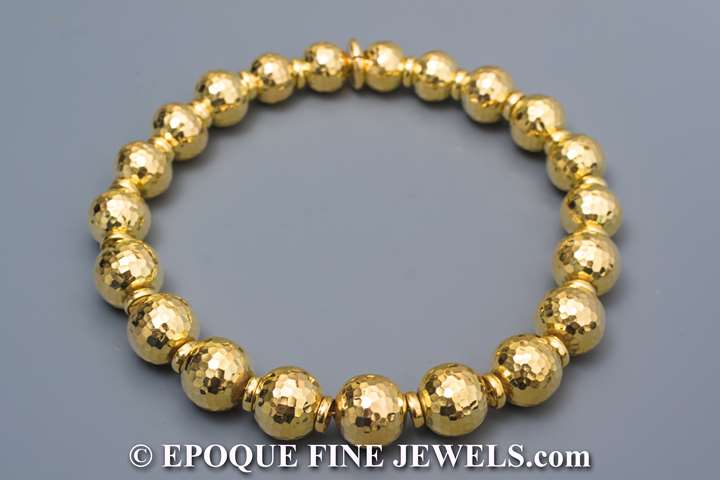 An 18 carat gold ball necklace